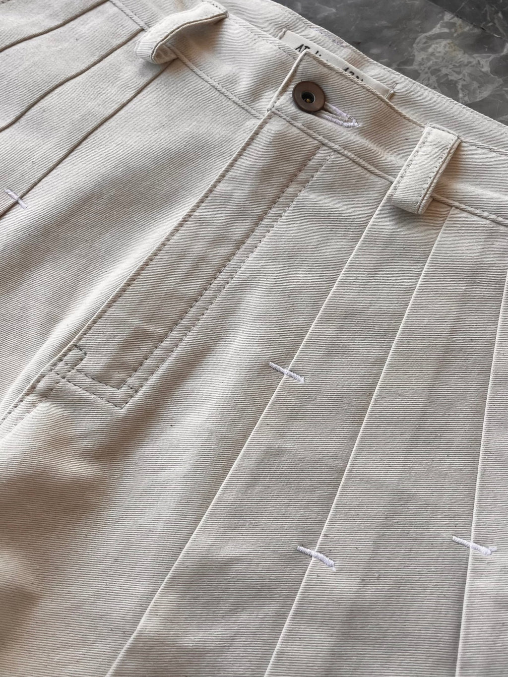 RIVET PLEATED TROUSERS